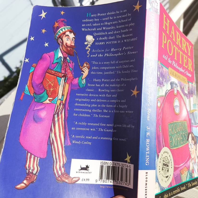 The cover of Harry Potter and the Philosopher's Stone showing a younger Dumbledore.